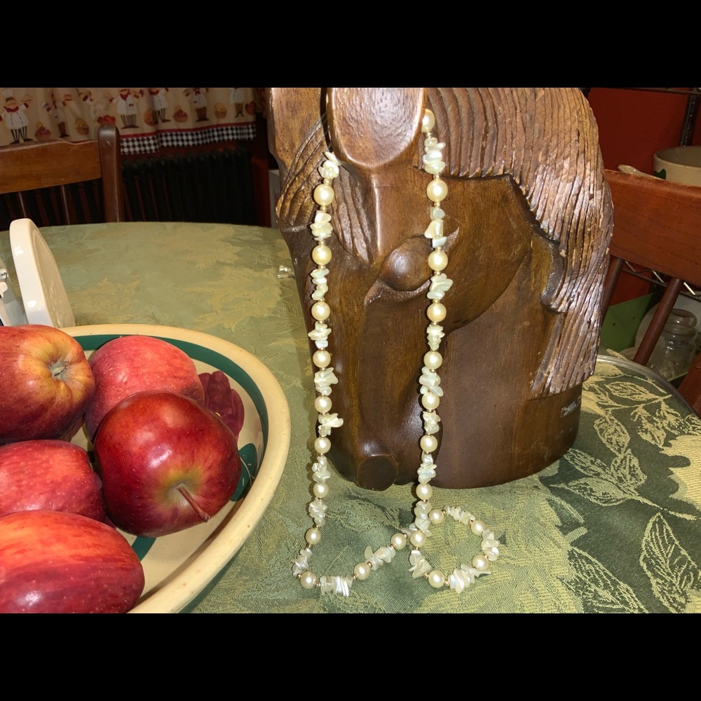 24 in white pearl an shell costume necklace.